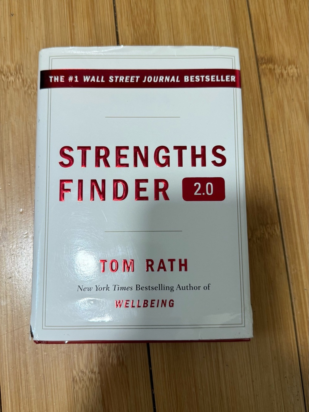 StrengthsFinder 2.0 Paperback Book in White and Red by Tom Rath